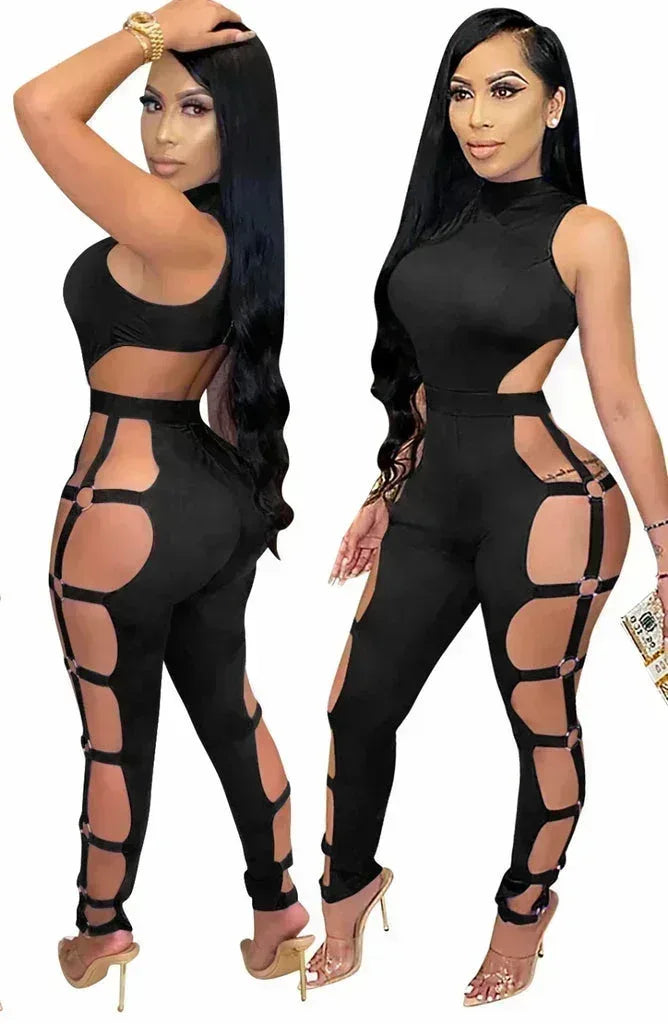 Woman in black cutout jumpsuit with high neck and side open straps, wearing high heels